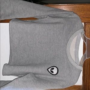 A crop top alien sweater